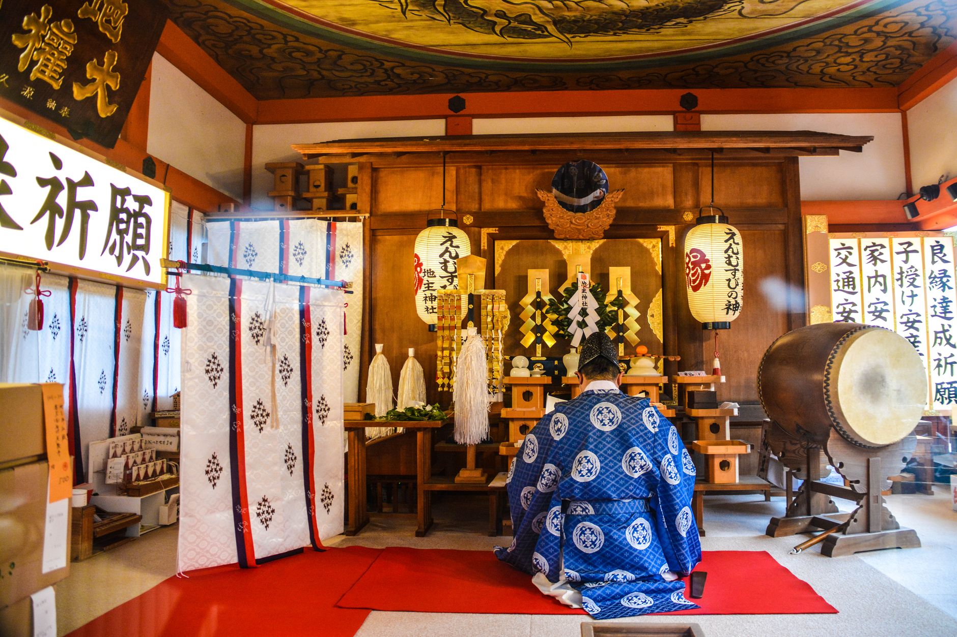 A serene scene depicting a traditional Japanese religious ceremony inside a beautifully decorated shrine, showcasing cultural heritage.