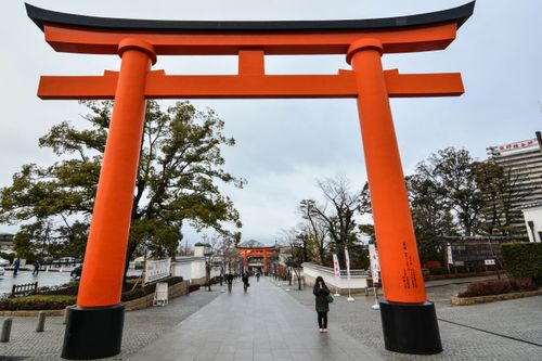 Free Iconic red Torii gate at Fushimi Inari Shrine, Kyoto, symbolizing Japanese tradition. Stock Photo