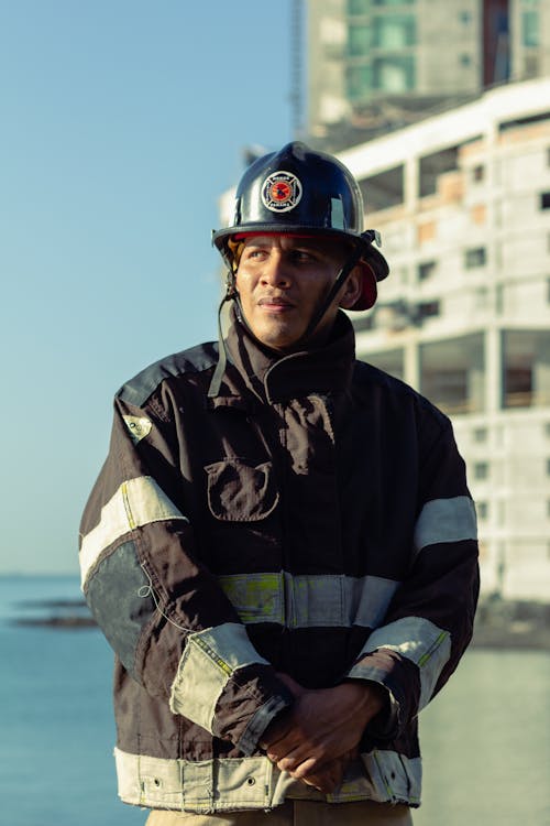 Man in a Fireman Uniform looking away 
