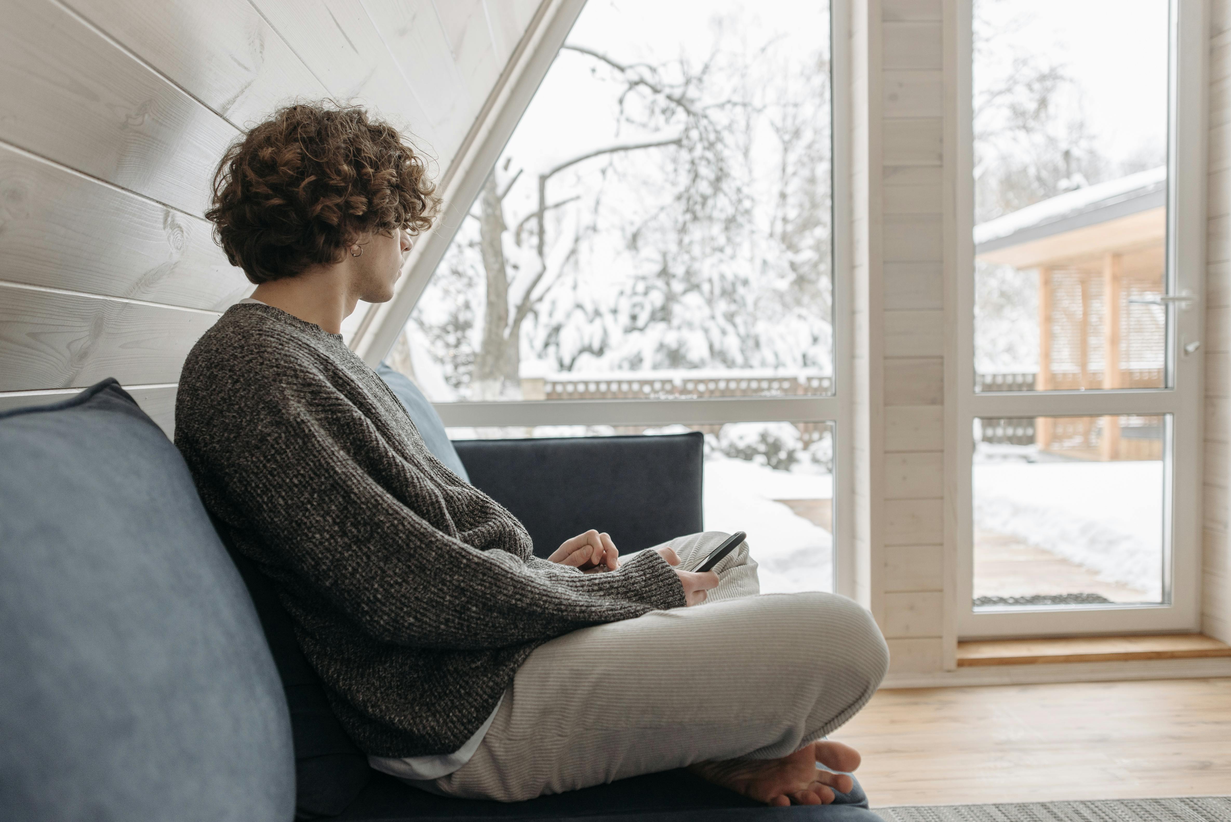 cozy living room with snow outside window - gas furnace installation allentown pa