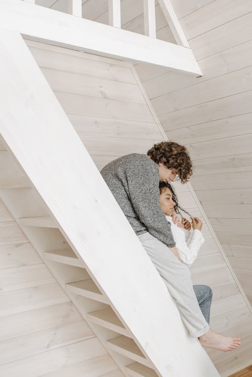 A Couple Sitting on the Stairs 