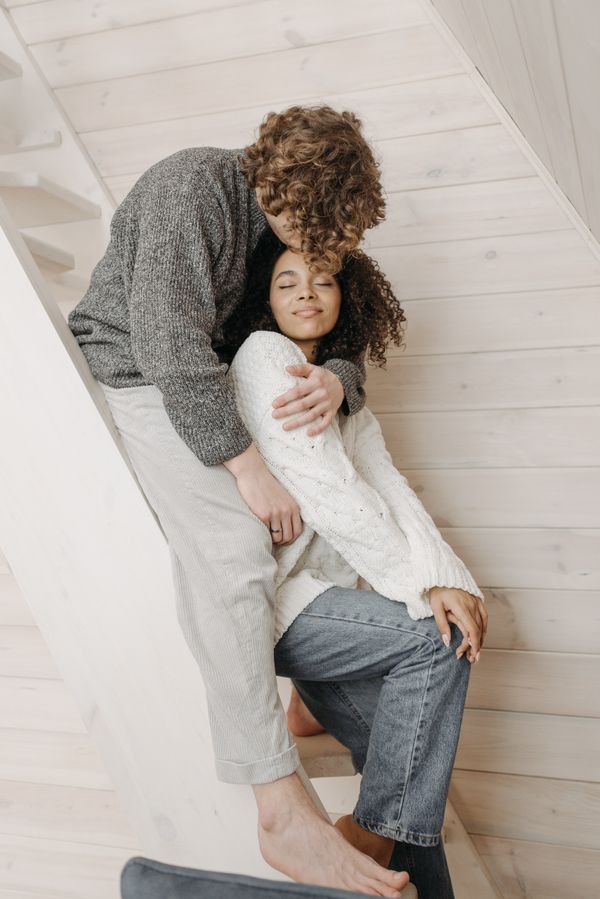Woman in boyfriend jeans with chunky knit sweater