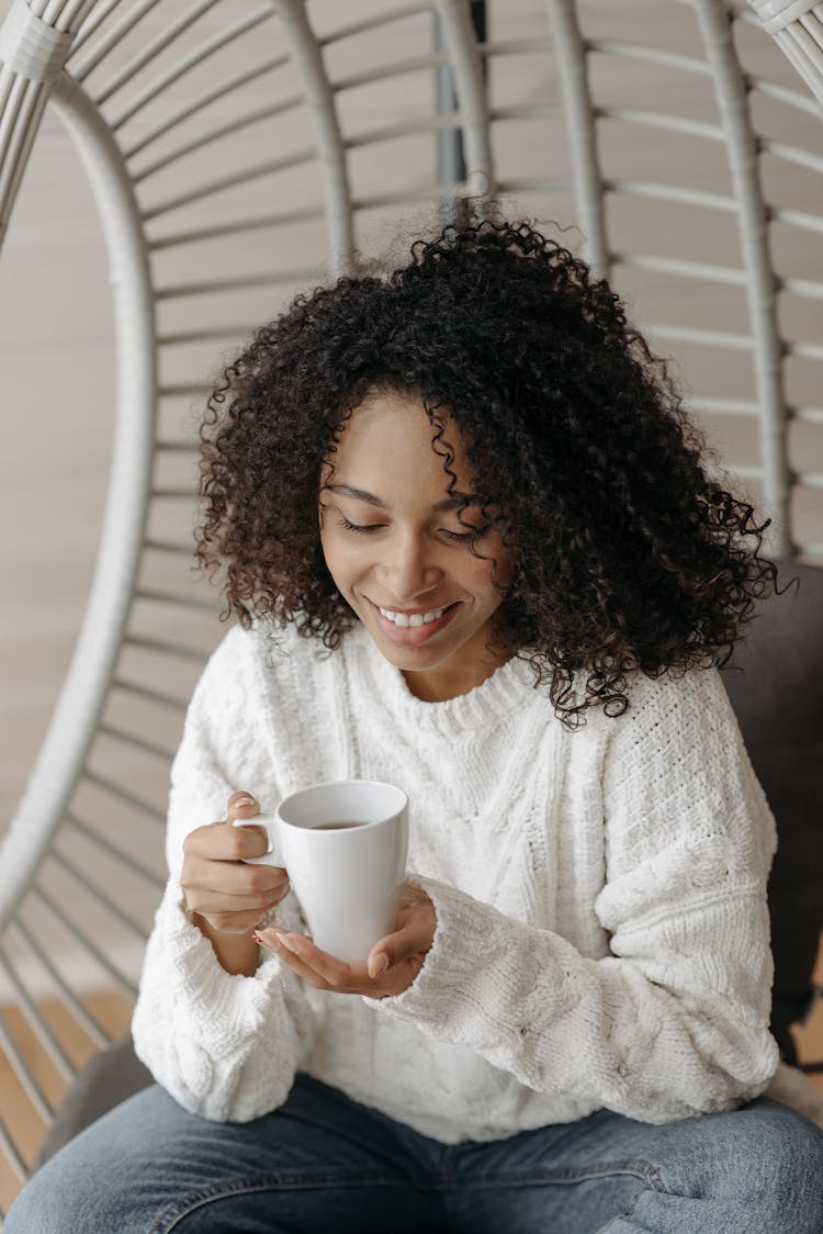 Woman Holding Tea In The Mug 