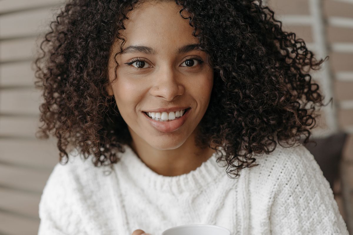 Woman with defined natural curls