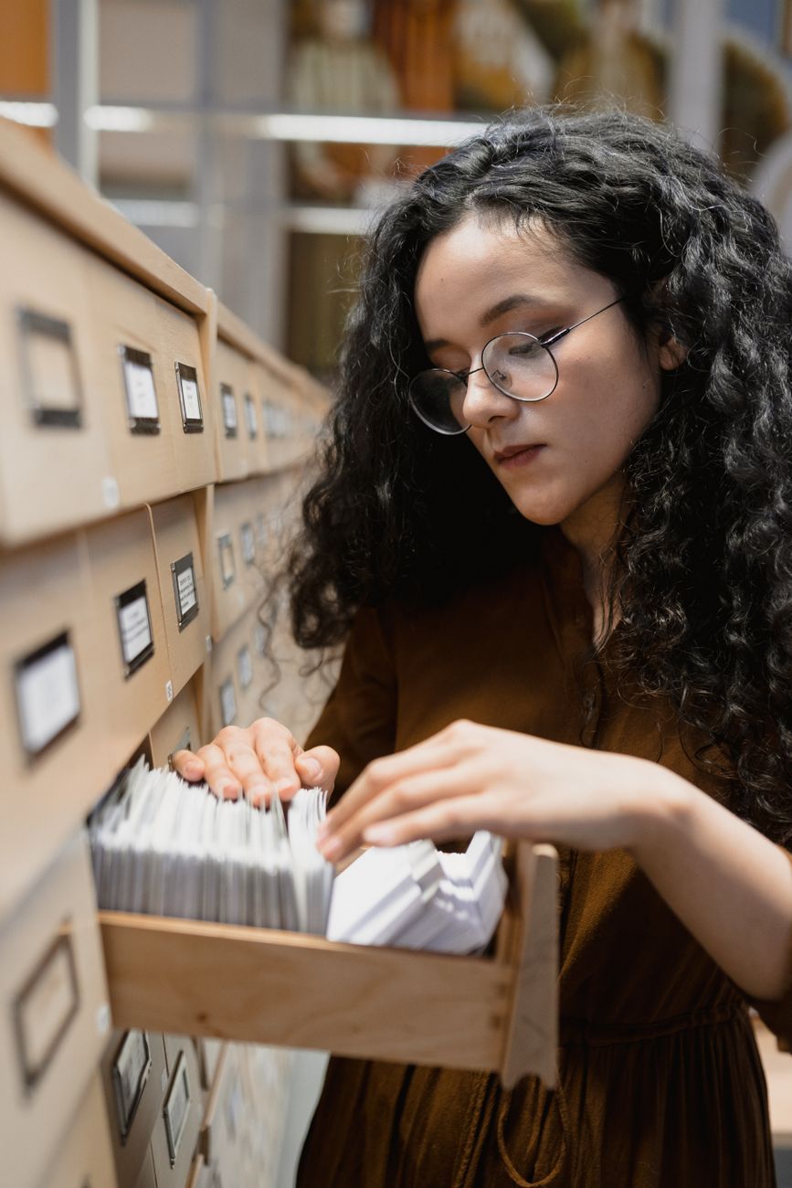 Rows of library card catalog drawers in a reading room