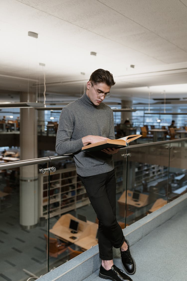 A Man Reading A Book 