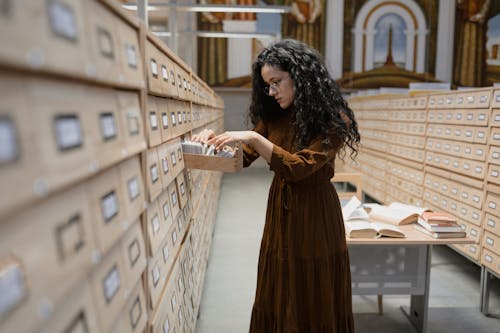 Free Student looking at an Archive Drawer Stock Photo