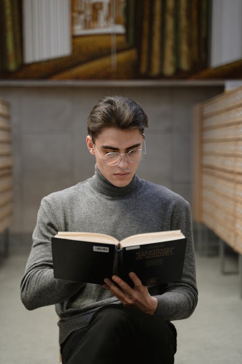 A Man Reading a Book