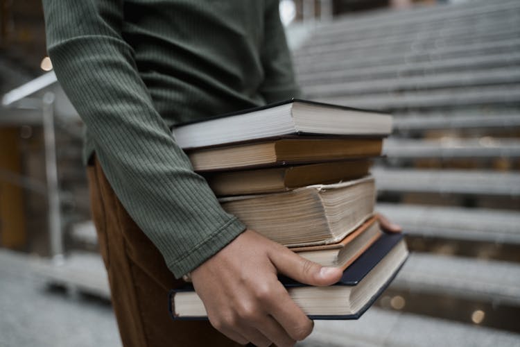 A Person Carrying Books