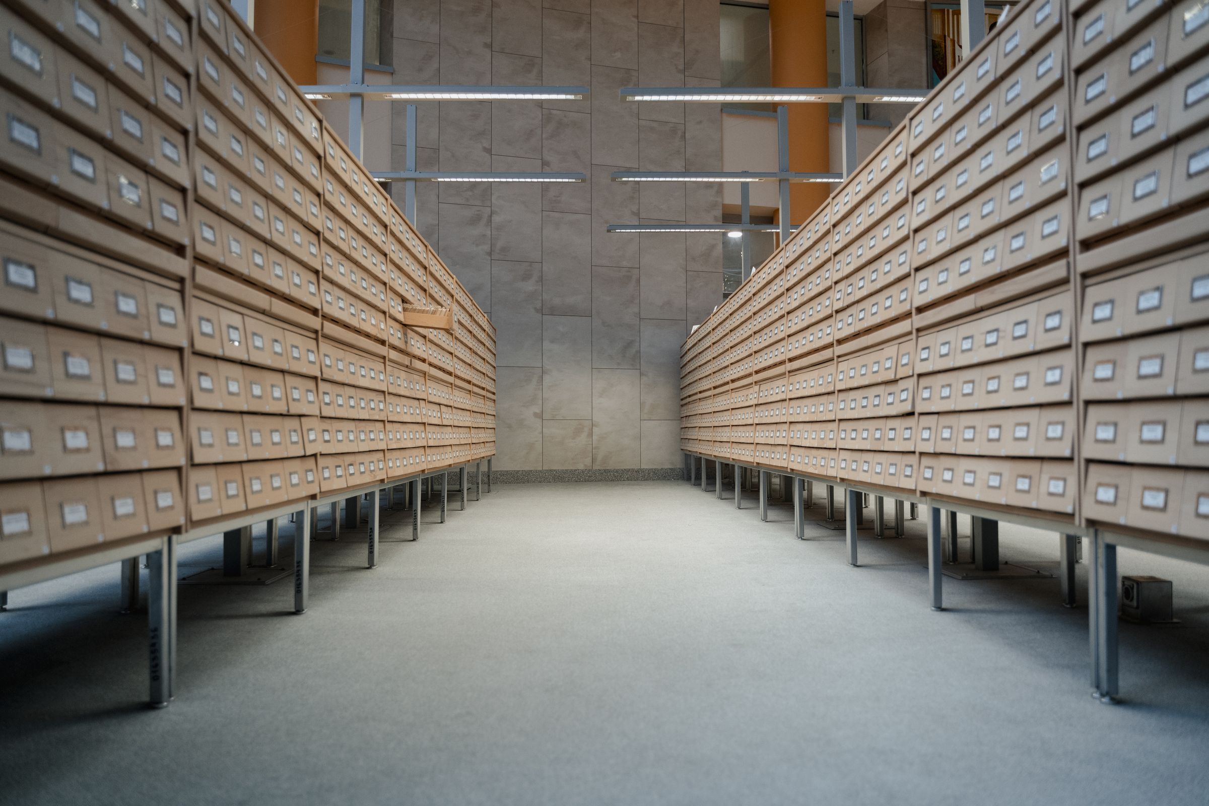 Editorial reference library evoking the calm, governed posture of NDIS readiness work