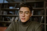 Man in Gray Crew Neck Shirt Wearing Black Framed Eyeglasses