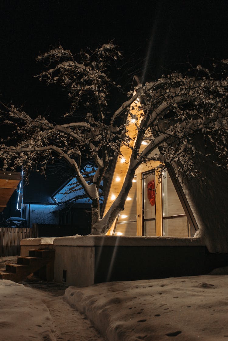 A Wooden Cabin At Night