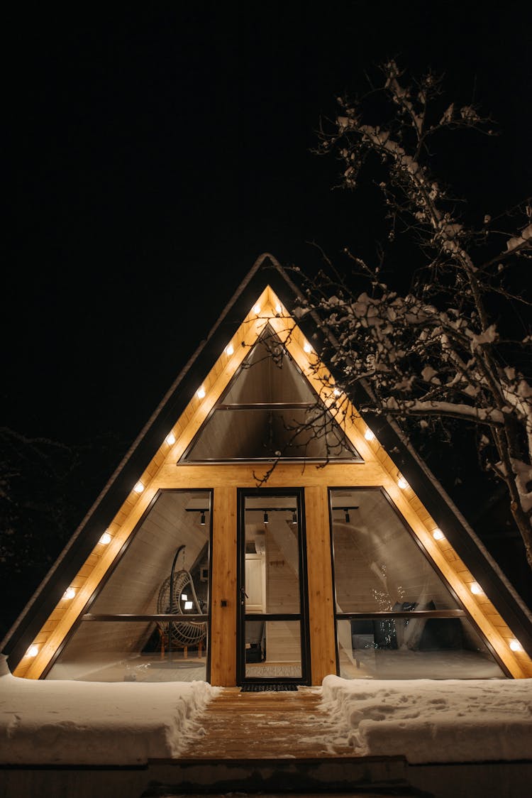 A Wooden Cabin At Night