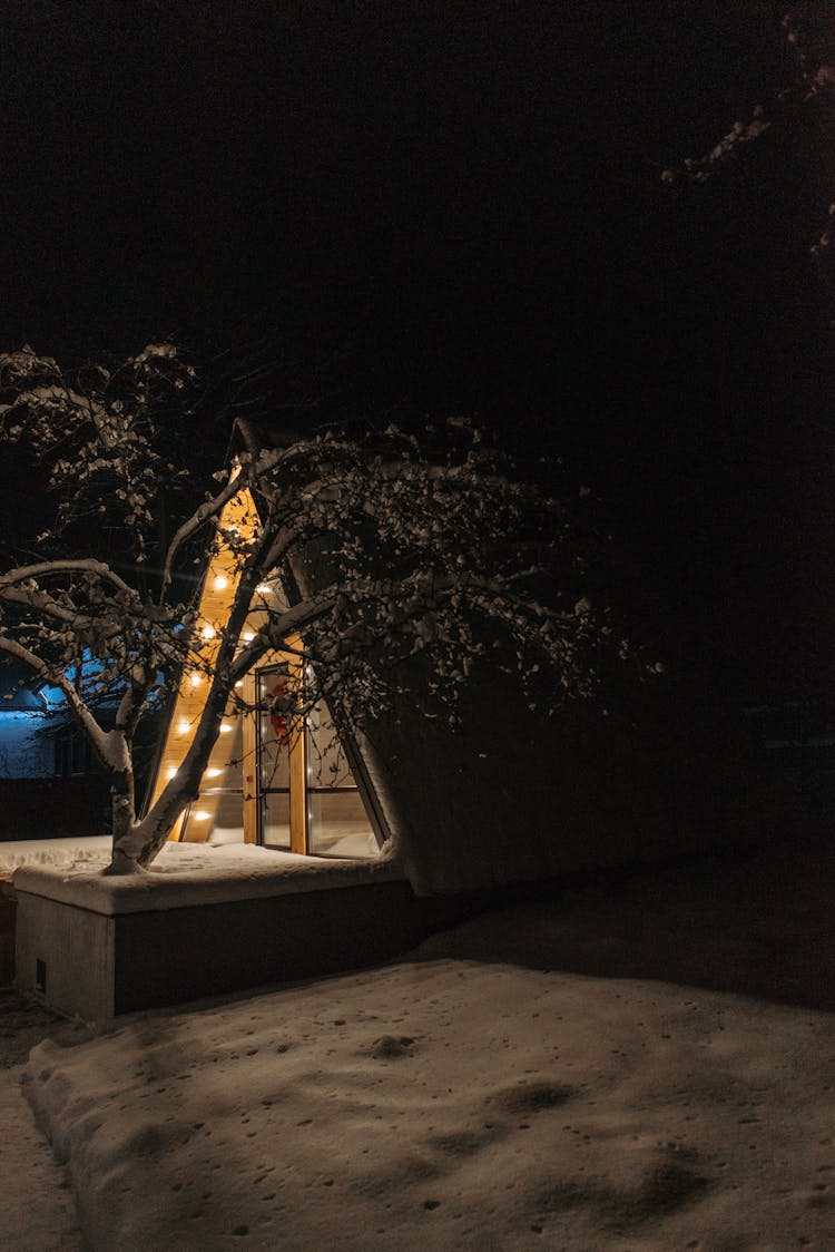 A Wooden Cabin At Night