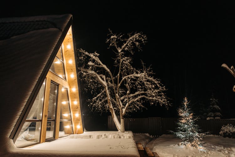 A Wooden Cabin At Night