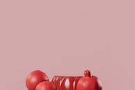 Red Fruit on Pink Background