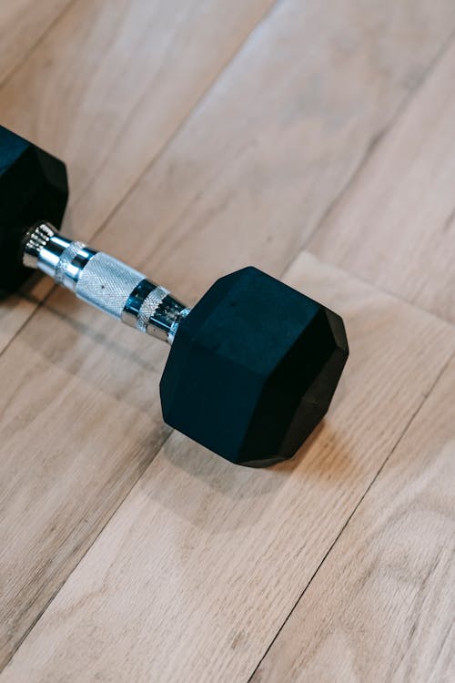 Metal dumbbell placed on floor