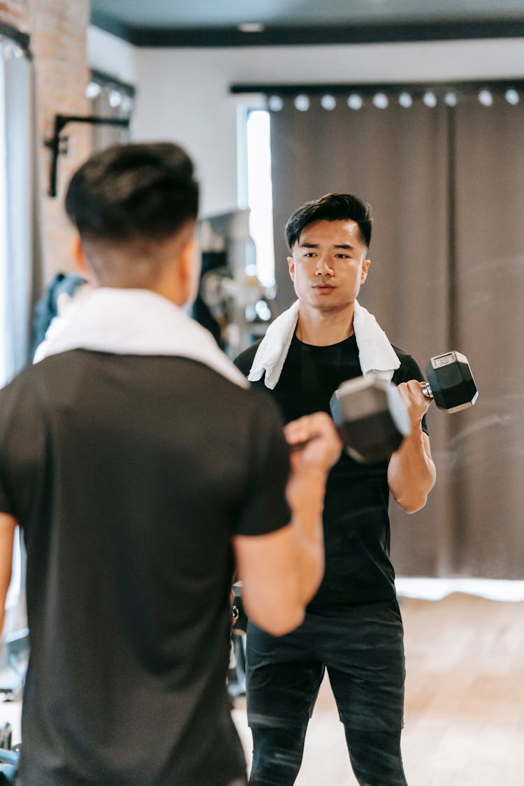 Masculine Asian Man With Weights In Gym