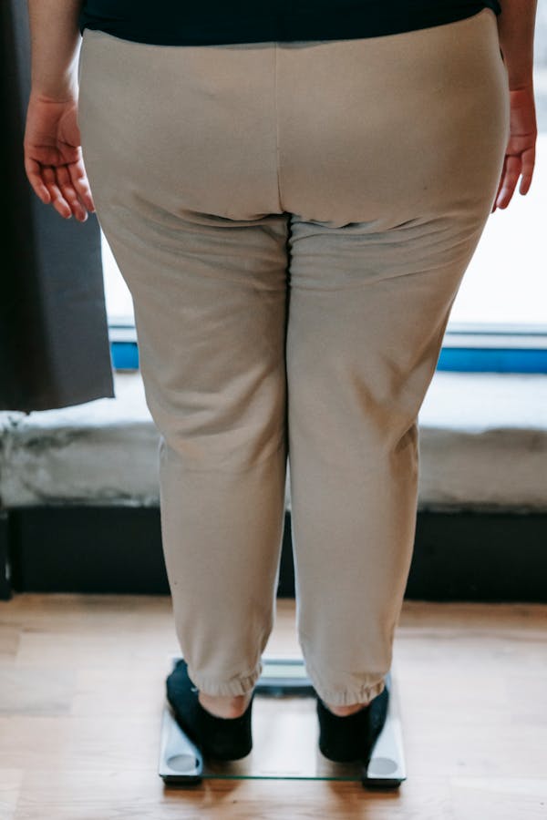 Woman Standing on Glass Scale