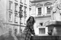 Woman in Plaid Dress Shirt Sitting on Concrete Bench