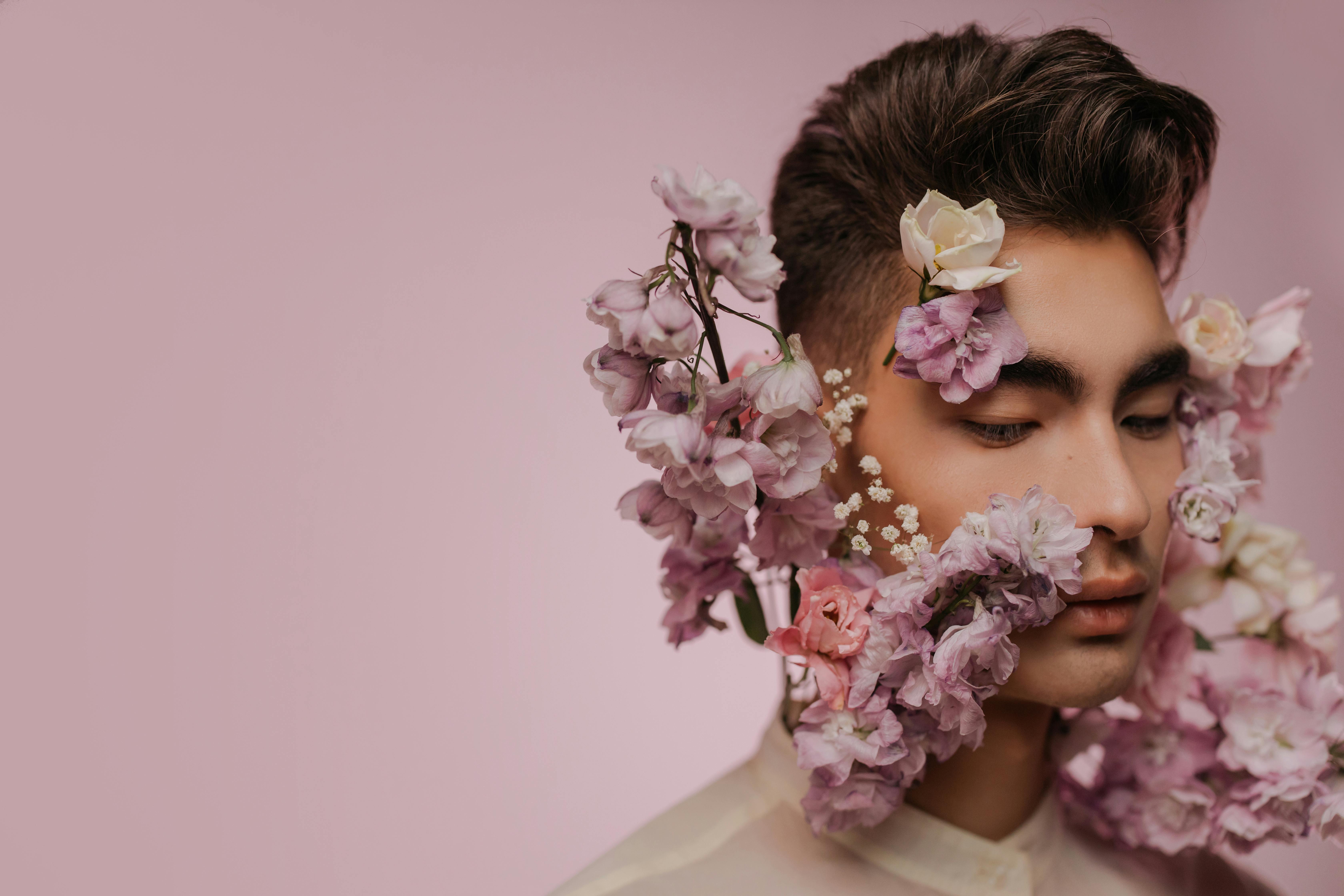 Download Man's Face With Pink Flowers Aesthetic Wallpaper