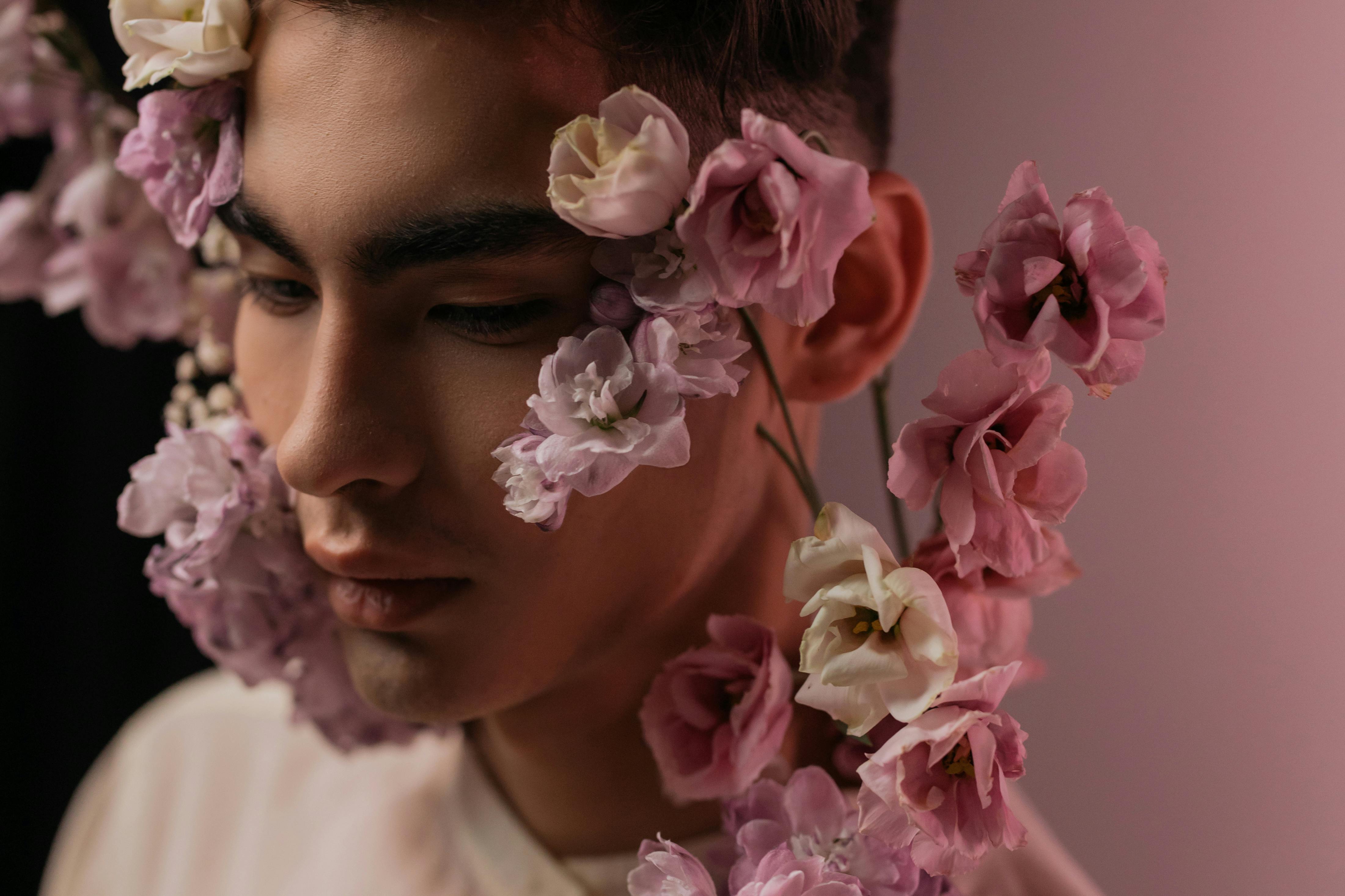 Download Man's Face With Pink Flowers Aesthetic Wallpaper