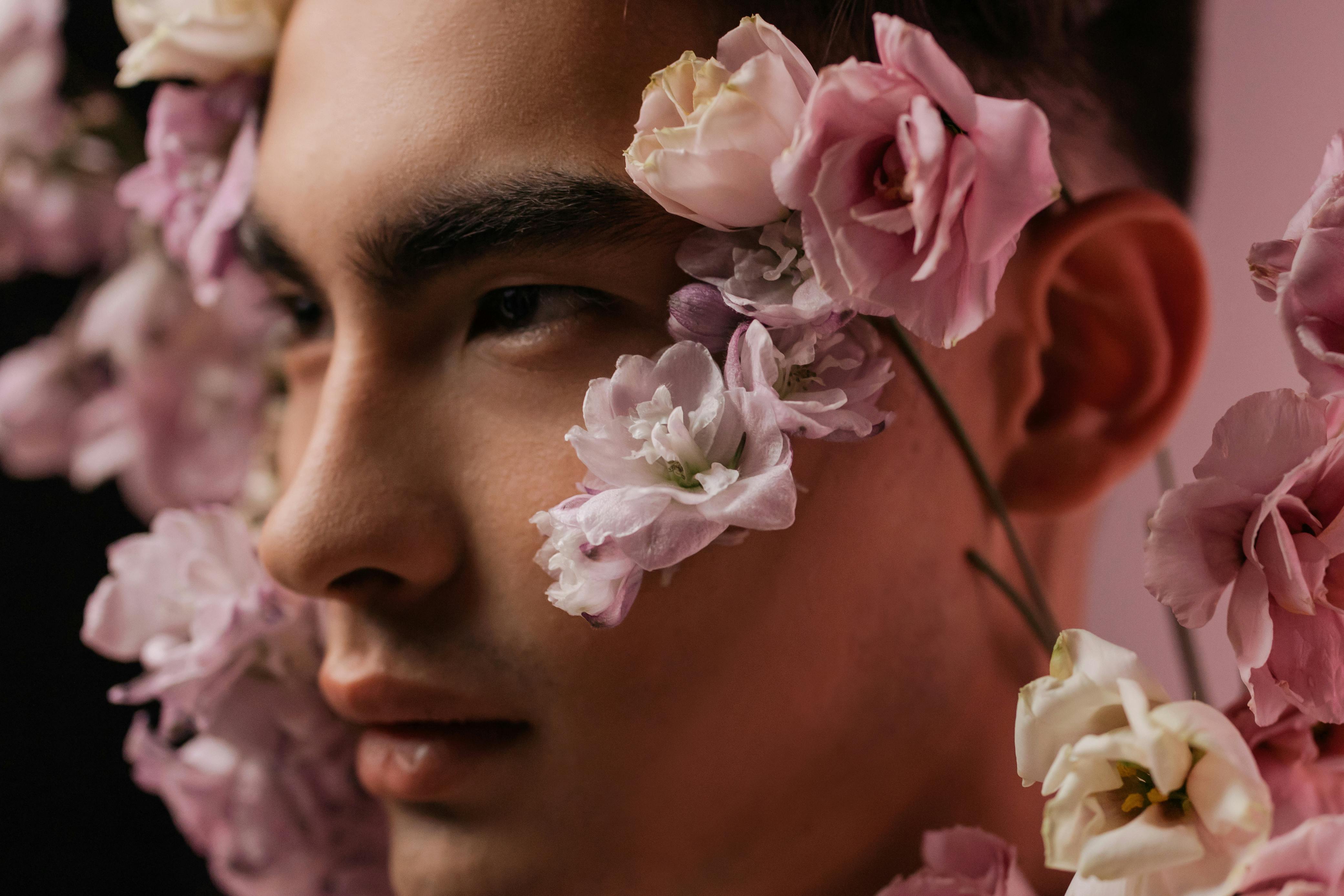 Download Man's Face With Pink Flowers Aesthetic Wallpaper