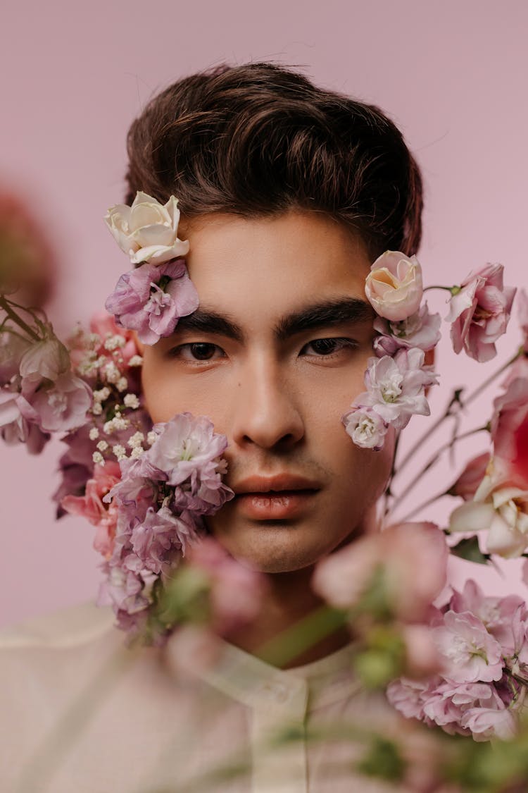 Portrait Of A Handsome Man With Purple And Pink Flowers