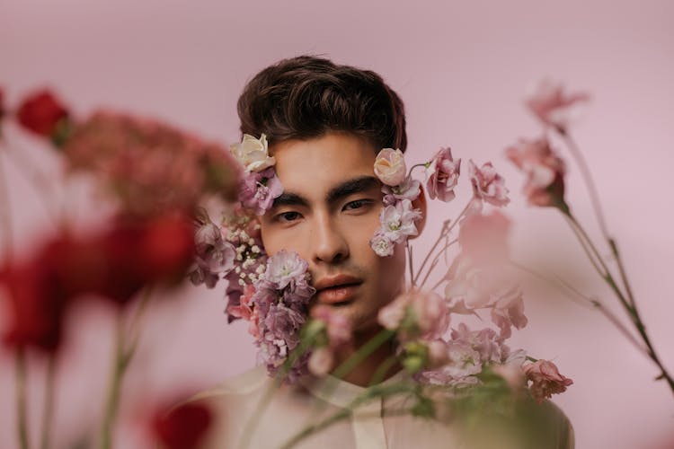 Portrait Of A Handsome Man With Purple And Pink Flowers