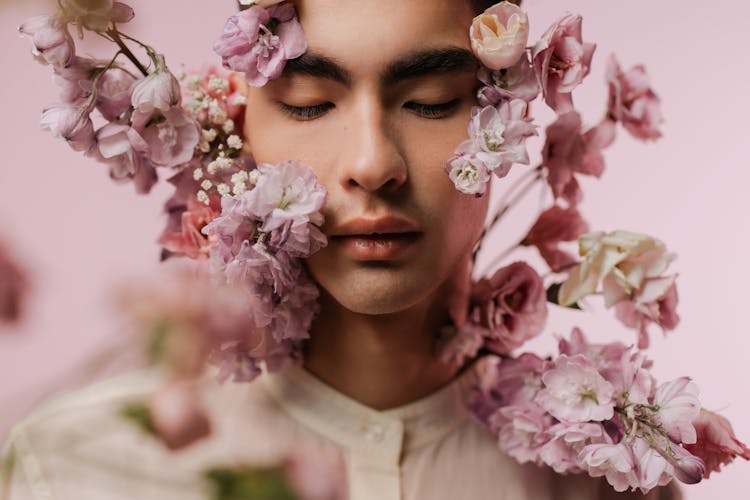 Portrait Of A Handsome Man With Purple And Pink Flowers