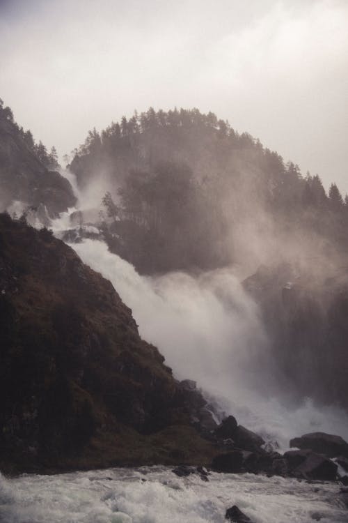 Rapid Waterfall Cascading down a Mountain 