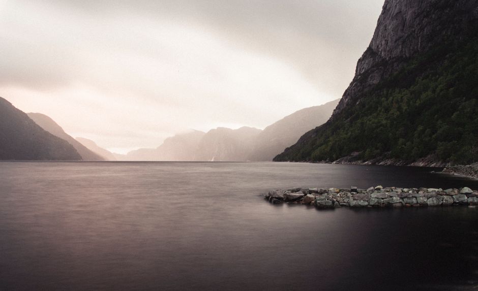 Captivating view of a Norwegian fjord on a serene day, showcasing nature's beauty.
