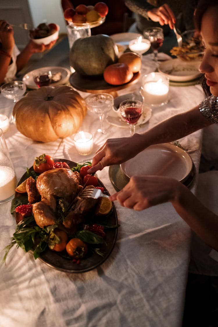 Person Slicing The Turkey