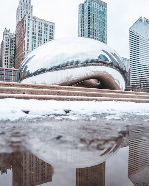Sculpture with Reflections in a City in Winter