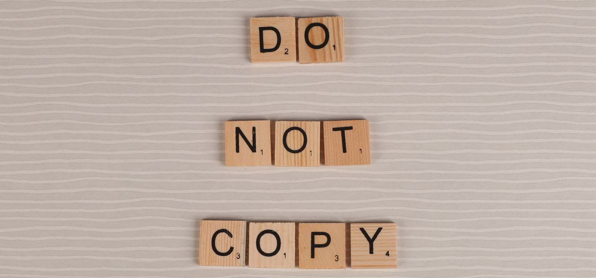 Wooden letter tiles arranged on a surface