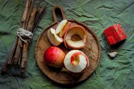 Sliced Apple Fruit on Brown Wooden Round Plate
