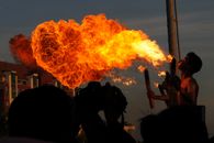 People Standing Near Fire during Night Time