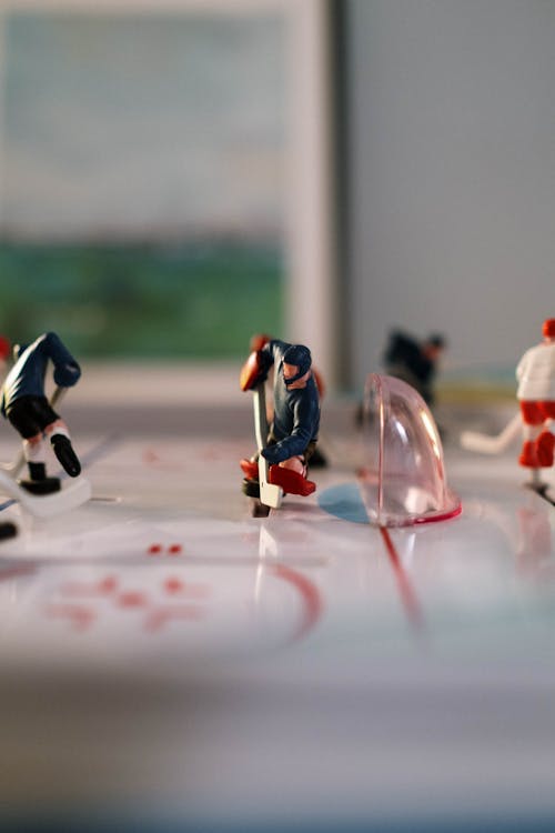 Close-Up Photo of Figurines on a Table Hockey