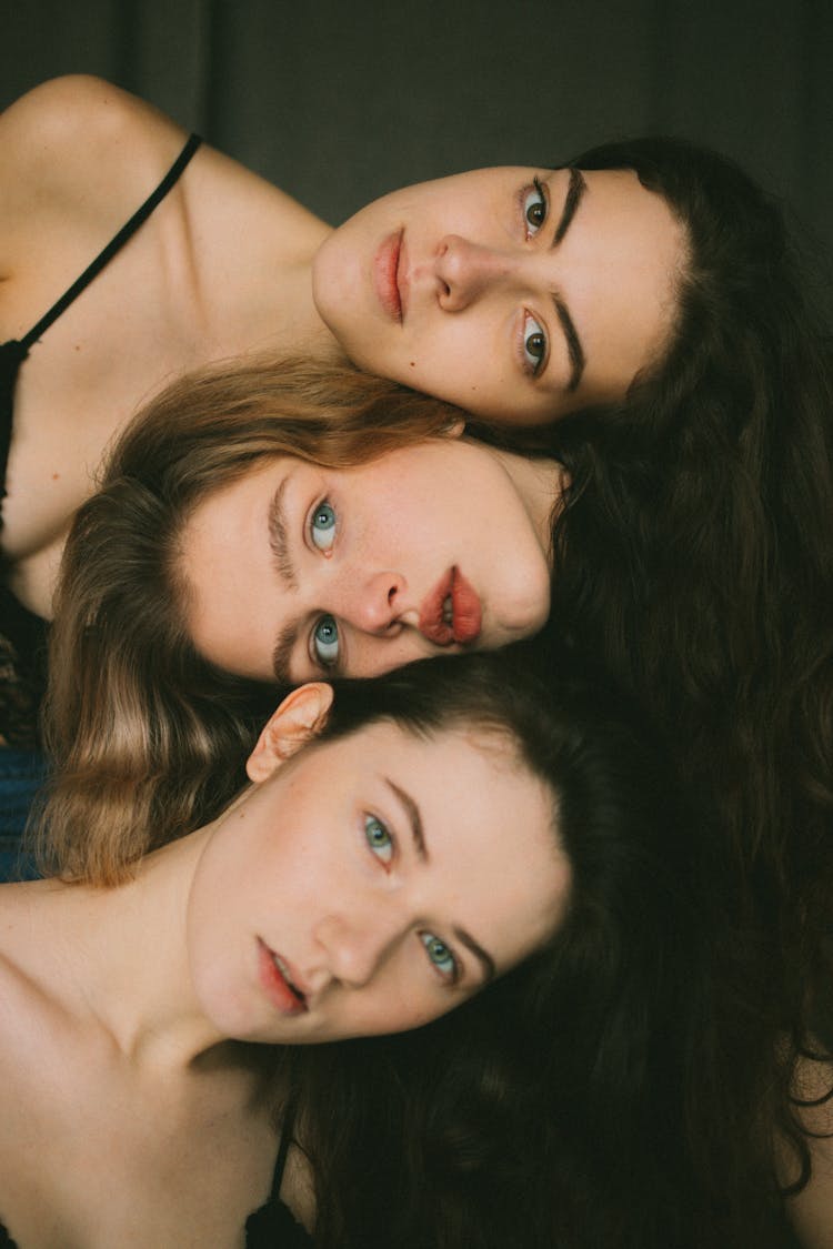 Peaceful Young Ladies Cuddling In Studio