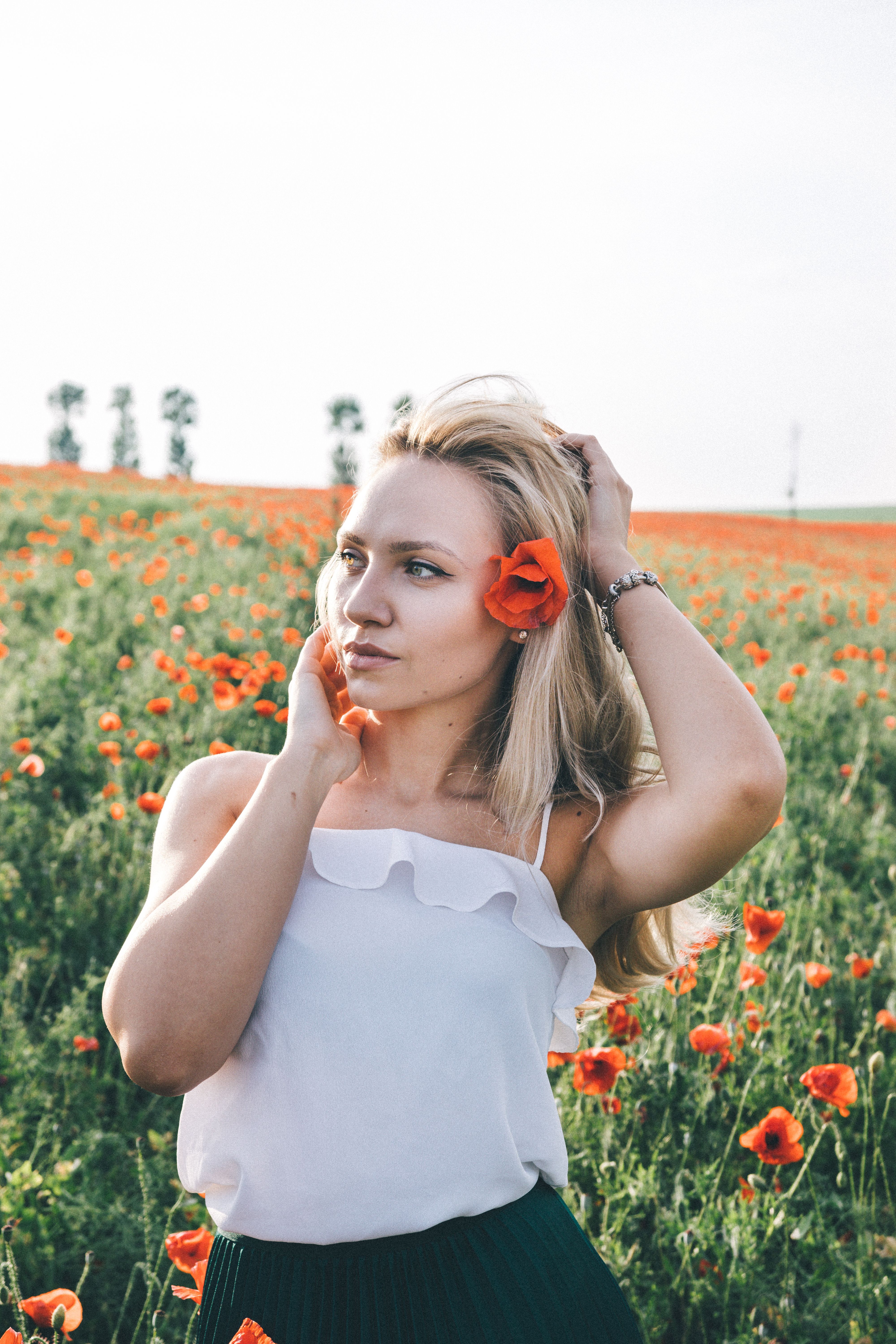 Portrait of a Woman Standing in a Field · Free Stock Photo