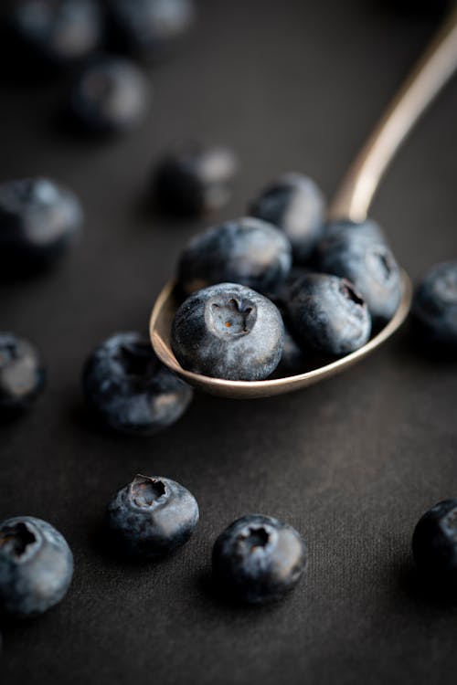Free Close-Up Shot of Blueberries on a Spoon Stock Photo