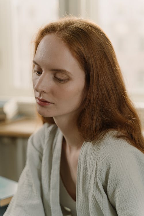 Redhead Woman Looking Down