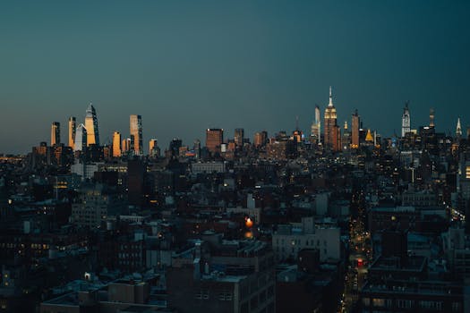 A captivating New York City skyline at twilight with the Empire State Building prominently lit.