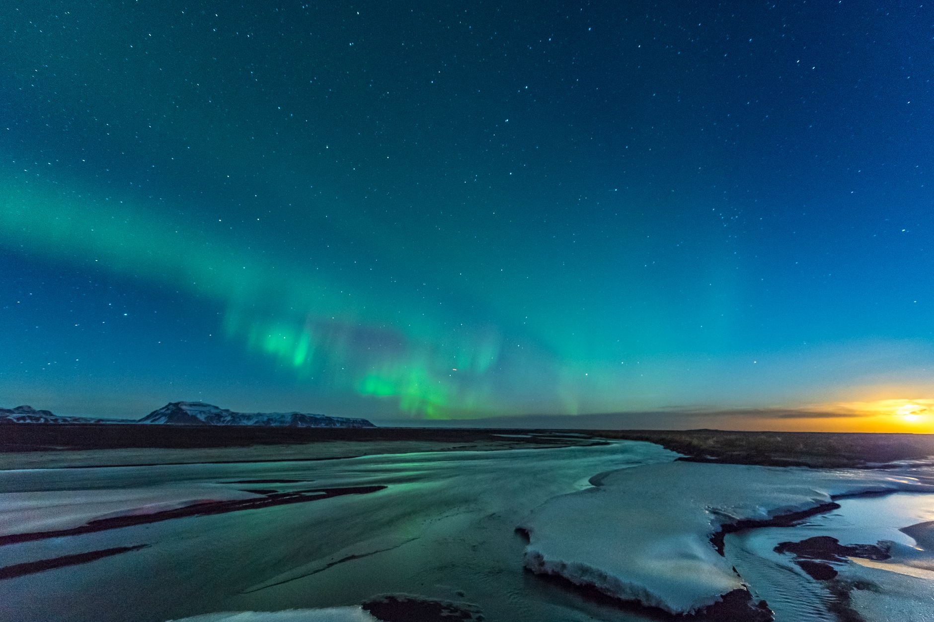 Northern Lights over an Icelandic winter landscape