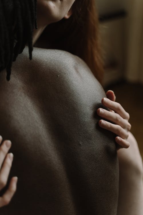 Free Close-up of a Biracial Couple Hugging Stock Photo