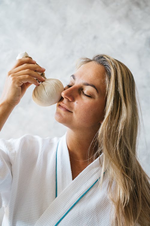 A Woman Massaging Her Face