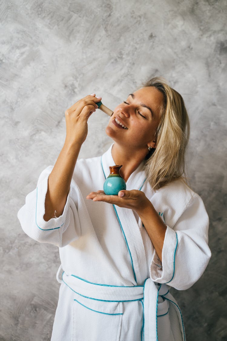 Woman In White Bath Robe Smiling