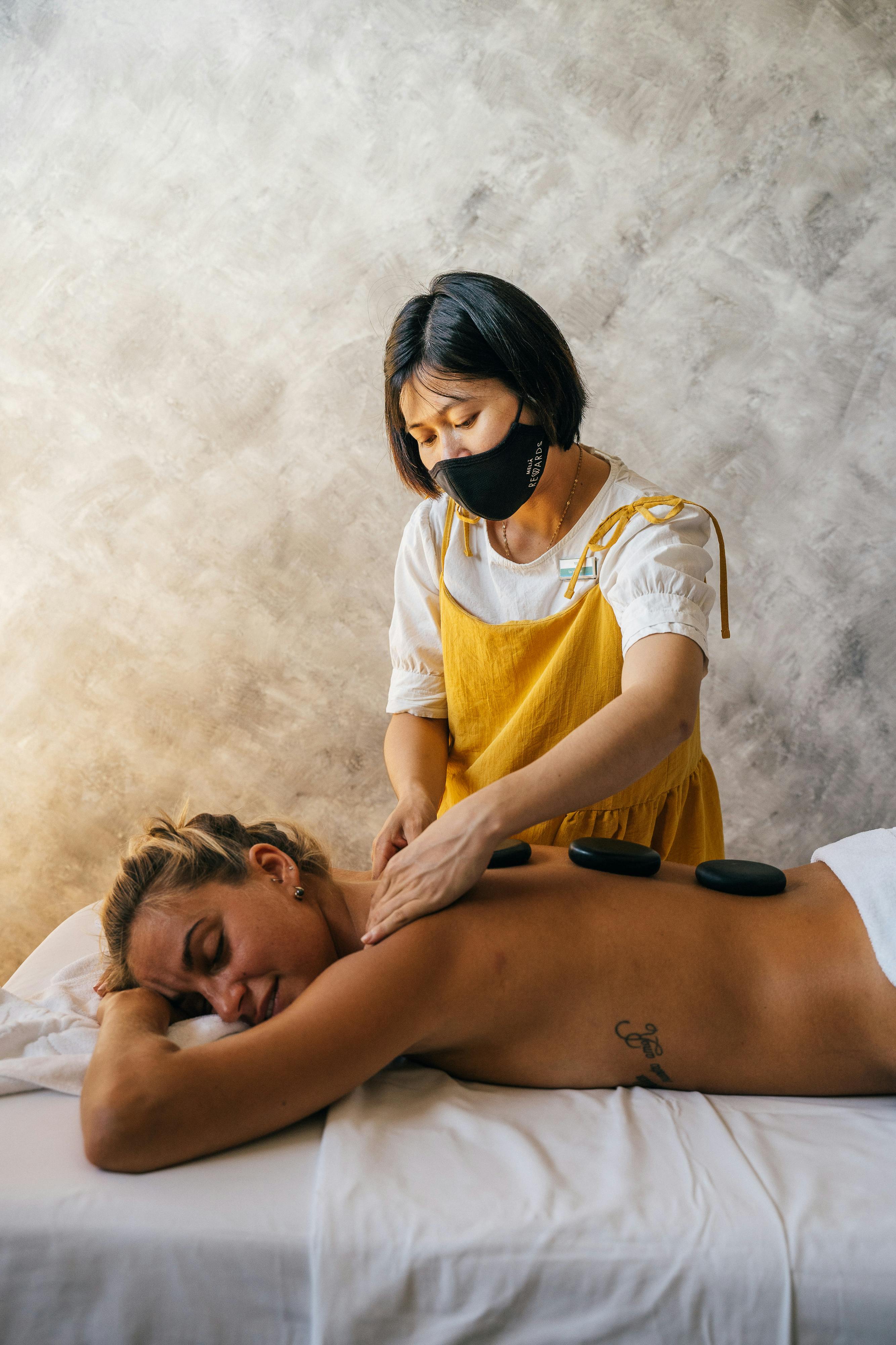 topless woman having a massage