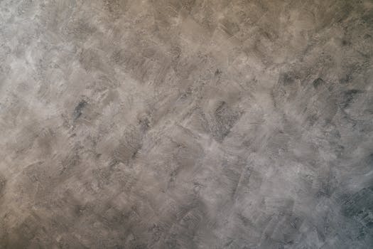 High-resolution image of a textured gray concrete surface ideal for backgrounds.
