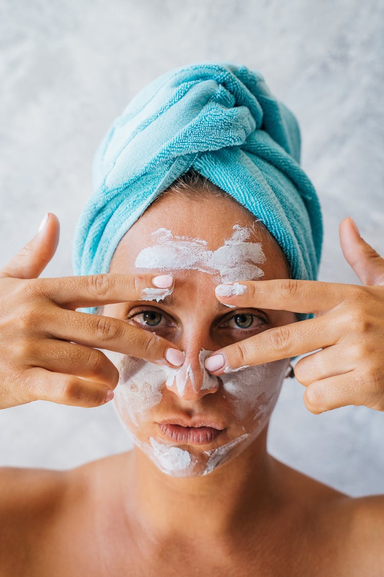 A Pouting Woman With Cream On Face